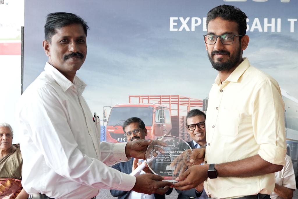 Honour receiving from Mr N M Radhakrishnan, Regional Service Manager - South, Eicher Trucks & Buses